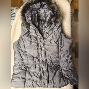 Vest with removable fur hood.